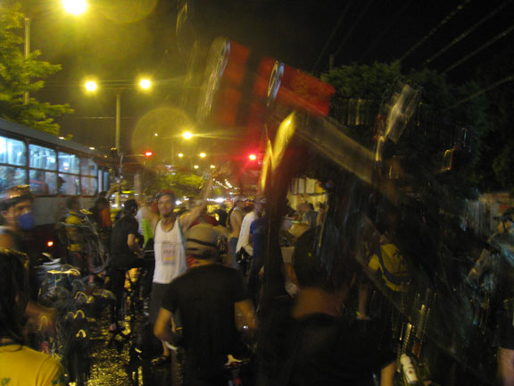 The Bike Lift is an increasingly universal gesture of Critical Mass cyclists, here in the pouring rains.