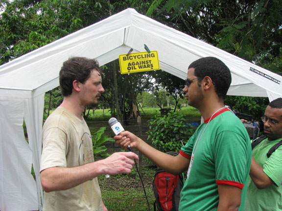 ze-paolo-interviewed-w-yellow-sign_6708 The media love the Bike Camp... here Ze Paolo is being interviewed.