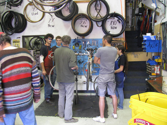bike-kitchen-consulting_7187 Everyone helping each other over a recalcitrant mechanical problem.