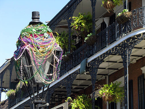 beads-on-light-and-balcony_7566 Beads cover street light in French Quarter, just after Mardi Gras 2009.