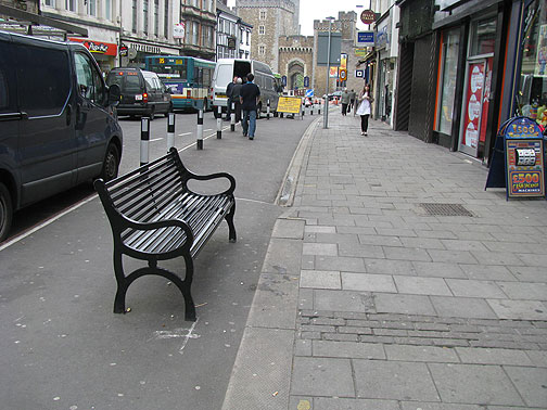 bench-in-bike-lane_8169 Seems like a new bike lane on St. Mary's but they put benches and bollards in it! go figure....