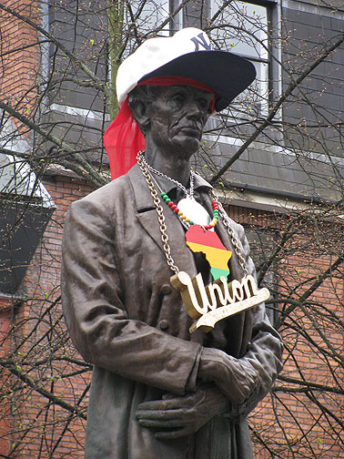 homey-lincoln_8556 Honest Abe as Homeboy? A weird art project commissioned by local authorities. The statue actually commemorates Lincoln's thanks to the textile workers of Manchester, for supporting the Union during the Civil War (and the effort to abolish slavery) even though it made life in England for working people much harder, since there was dire shortages of raw cotton due to the embargo against the South.