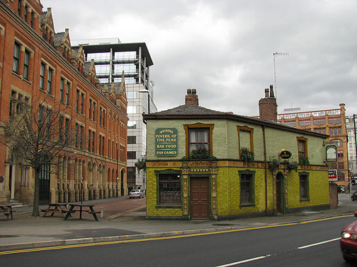 manu-hooligan-pub_8504 The historic pub is a favorite of Manchester United hooligans... surrounded by new development and redeveloped old buildings.