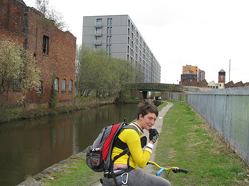 nes-on-canal-w-bldg-overgrown_8491 Nes pausing on canal, ruins and new development in distance.