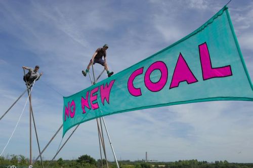 Tripods with Kingsnorth power station in the background, Climate Camp, Kent, 9 August 2008 (photo: metamute.org)