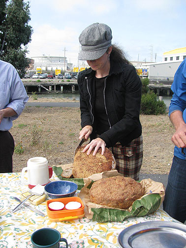 biking-biting-lr-cutting-bread_1344 LisaRuth cuts her ever-more famous and always astonishingly delicious bread!