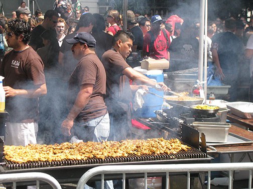 streetfood_indian-chicken_1397 Some Indian chicken cooking... the booths filled the middle of the street, so you could walk behind the "kitchens" along the western sidewalk and get a great show!