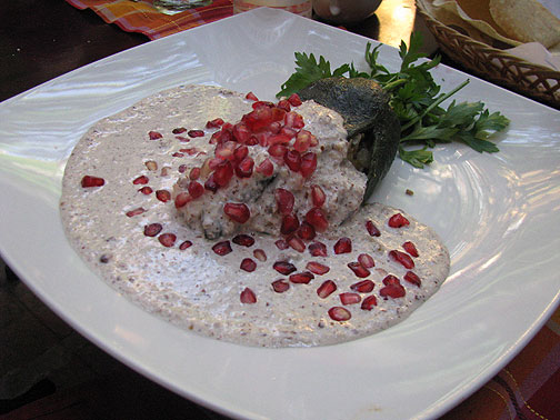 chiles-en-nogada_2193 Chiles en Nogada... a special seasonal dish: stuffed pepper covered in walnut sauce and pomegranate seeds... yowza!