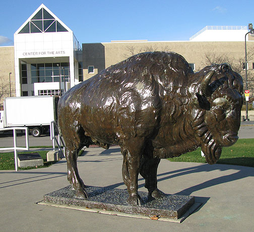 The bronze mascot in front of the North Campus Center for Arts.