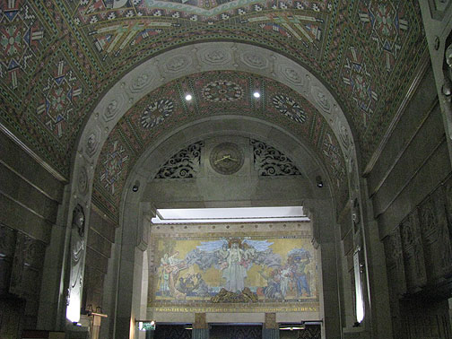 city-hall-lobby-frontiers-unfettered-by-frowning-fortress_2671 The lobby is full of Indian motif deco and some mosaic murals... through the arc the slogan on the mural says: "Frontiers Unfettered by any Frowning Fortress."