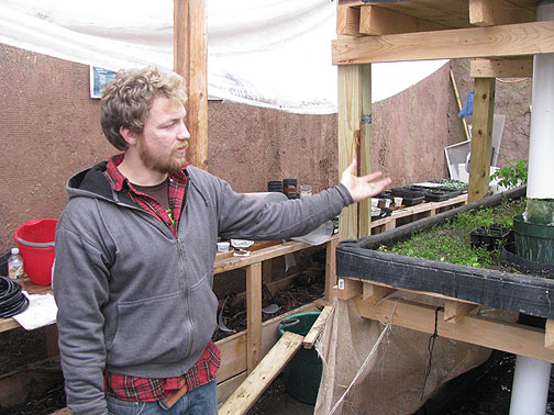 jess-meeder-at-fish-farm-mass-ave-project_2653 Jesse Meeder explains how the water circulates from one area to another in his fish farm.