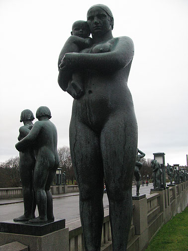 woman-w-baby-and-bridge-of-statues-behind_3096