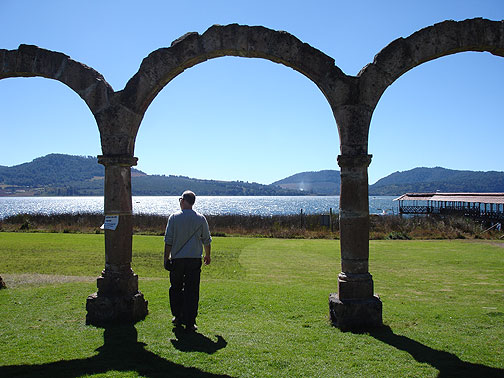 cc-in-zirahuen-arches3778 Apparently an old hacienda or monastery used to sit at the lake shore, but all that's left are these arches. A few dozen yards to my right in this photo is a pier stretching out into the lake for boat trips, and a weird cluster of fish restaurants and artesania booths.