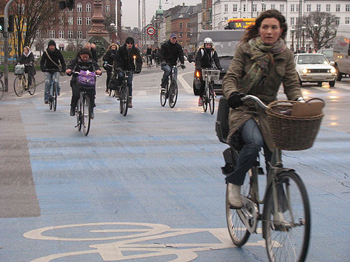 cycle-chic-on-norrebro-bridge-blue-lane_3691 A typical scene of cyclists crossing the Norrebro Bridge in Copenhagen.