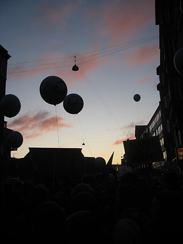 march-at-sunset-with-balloons_3935 Sun set on the December 12 march about 2/3 of the way through, leading to this gorgeous moment.
