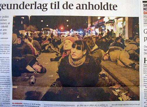 saturday-arrestees-on-street_4077 From the local paper, arrestees held on street for 3 hours with no bathrooms, drink, or food, in freezing temperatures. A young Swede told us how neighbors hung red curtains and blankets out the windows in solidarity, that one person set up a projector and projected "Let Them Go" on the opposite wall, and another neighbor played loud music into the street. At least two demonstrators were hustled into someone's home to avoid arrest too!