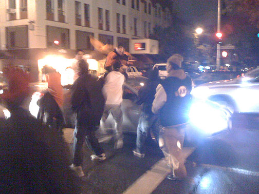 22nd-and-Mission-guy-out-of-sunroof-greets-teens-Giants-NLCS-Champs-celebration-on-Mission-Street-2010-044