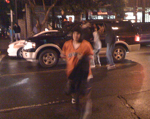 Kids-in-street-at-car-w-orange-jersey-returning-Giants-NLCS-Champs-celebration-on-Mission-Street-2010-041