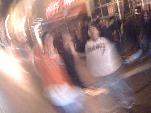 swirling-shot-of-two-kids-with-giants-shirts-Giants-NLCS-Champs-celebration-on-Mission-Street-2010-047