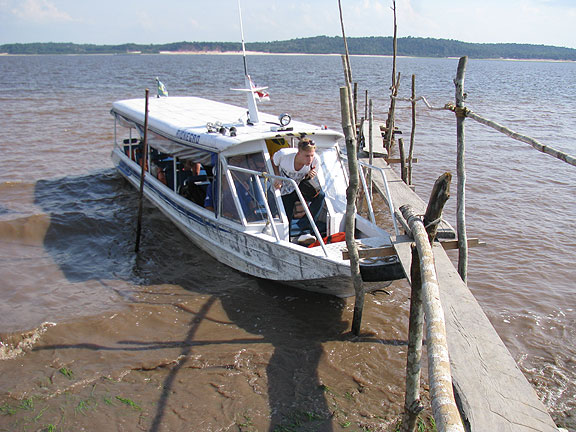 Simo-climbing-out-of-boat-to-go-to-tree_0978