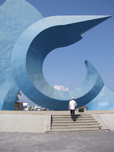 cc-walking-up-to-dolphin-sculpture_1584