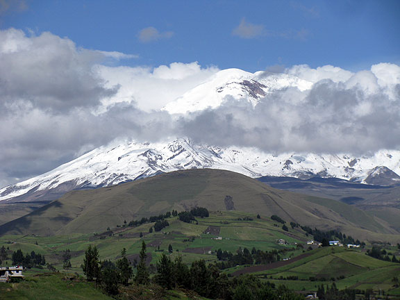 Chimborazo-poking-out-of-clouds-with-farms-beneath_3720