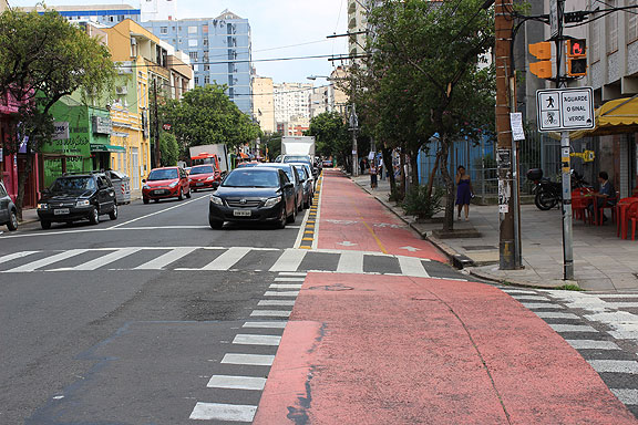 I was in Porto Alegre for the 1st World Bike Forum in 2011, which was held on the 1st anniversary of a mad businessman driving through Critical Mass at full speed along this street. There is now a dedicated, separated cycletrack on this same street. Looks like progress to me!