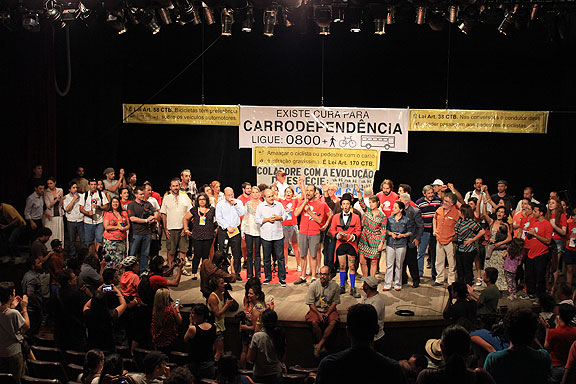 Speaker and audience alike gather in solidarity the Mayor after an extended period of heckling from transit fare activists.