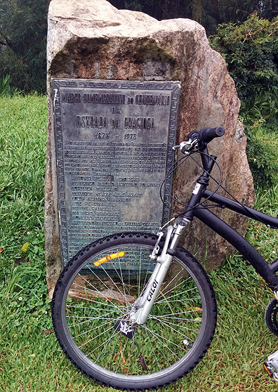 Monument to the building of the Serra da Graciosa road in the 1870s, here with one of our 70+ bikes in front.