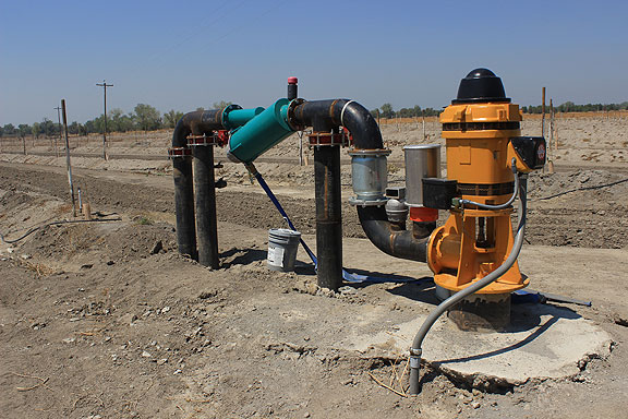 This pump is surely meant to tap the aquifer, but given the desolate surroundings, is clearly not in use at this time. Don't know if it's because the water table has fallen too far in the drought, or if it was for some other reason.