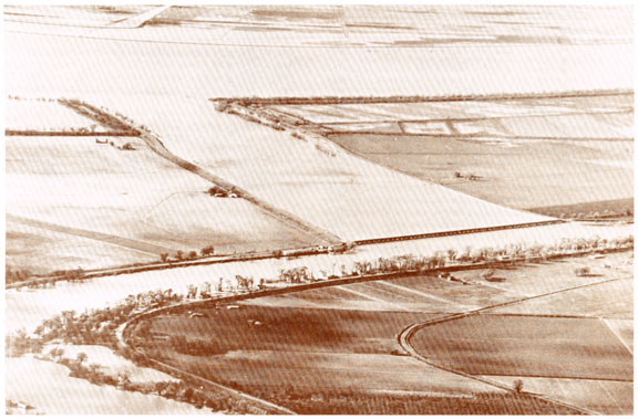 In this U.S. Army Corps of Engineers photo you can really appreciate the function of the Sacramento Bypass, which allows flood stage waters to divert across into the Yolo Basin in a deliberate and controlled manner.