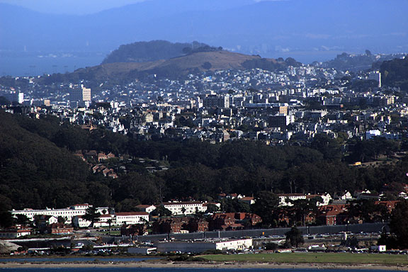 For those who knows SF, this is a very weird perspective. Bernal Heights is the hill but seen from way north in the Marin headlands the whole Mission District is squeezed in the space below the hill and on the far side of the Presidio in the foreground (not to mention the intervening neighborhoods before you even get to the Mission!)