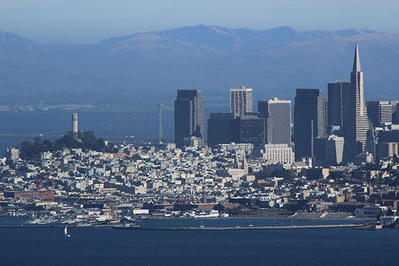 Unusual framings available from the Marin headlands looking south across the City. The zoom lens collapses the background into the image, creating the impression that there are hills not far behind the city's skyline.
