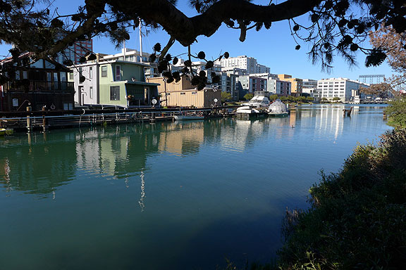 The houseboats along Mission Creek, self-organized and self-managed with a 99-year lease from the Port... behind looms the market rate condos built earlier in the build-out of Mission Bay.