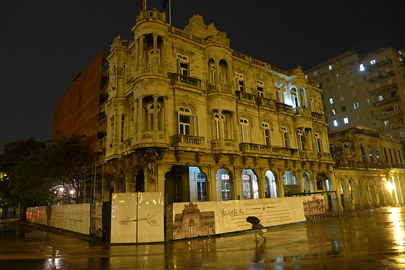 One of many elegant buildings in Havana being restored, a graffiti tagger hit the sign with the word "Yankier"...