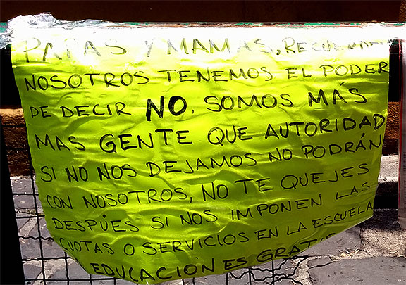 Close-up on the sign on the railing.