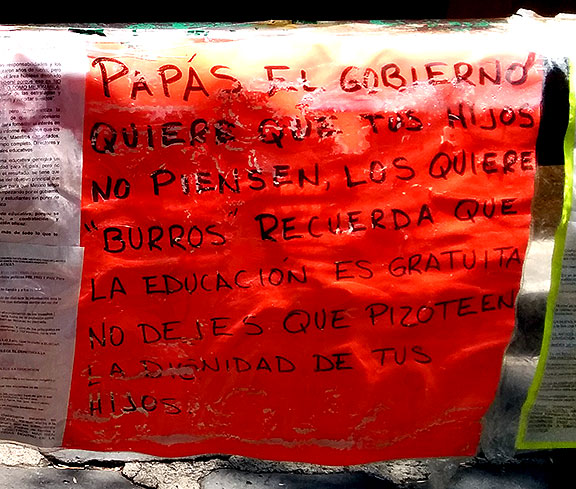Another sign on the railing.